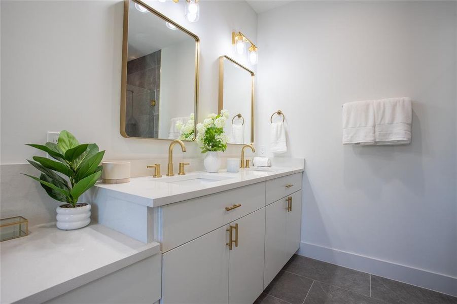 Bathroom featuring tile patterned floors and vanity