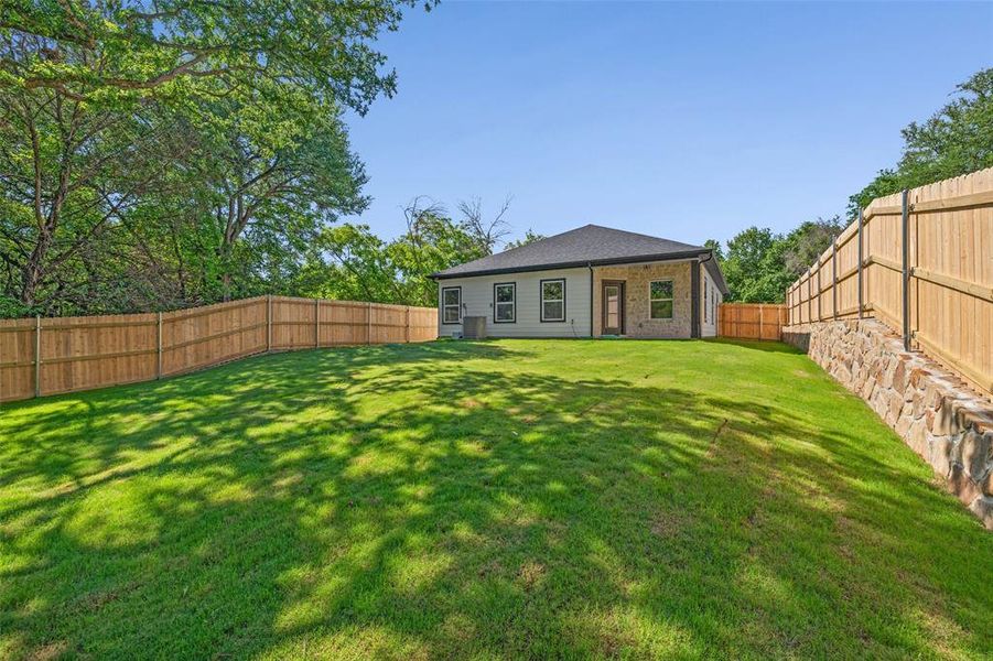 Expansive green lawn providing ample outdoor space