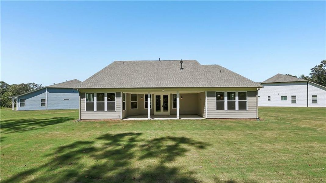 Exterior details and patio area of a home in Cresswind Georgia at Twin Lakes, Hoschton (Image 4).