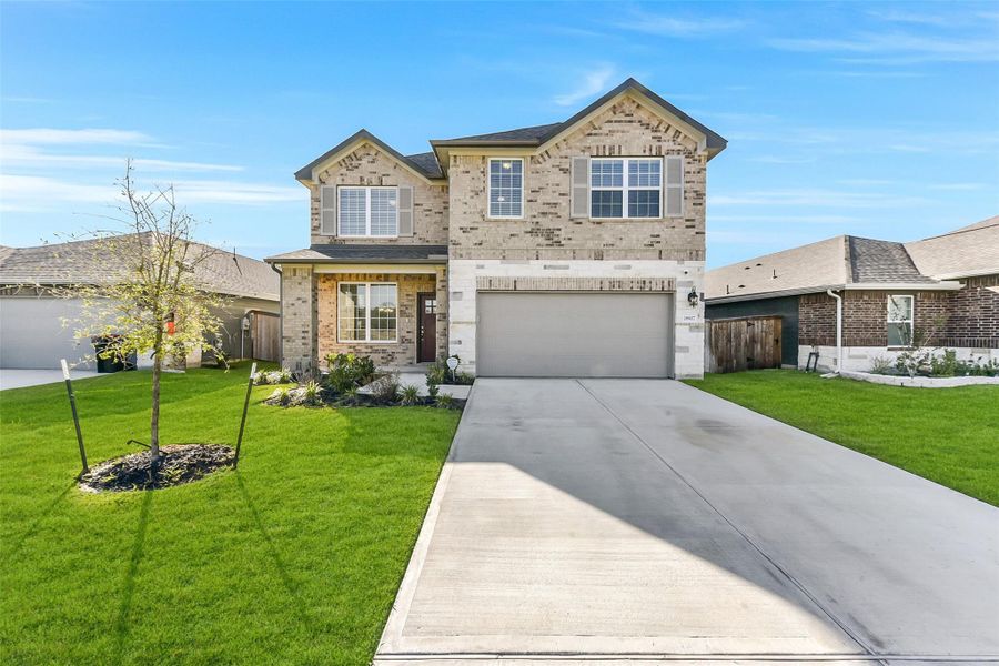 Front exterior of a new home in Sundance Cove - Premier Series, Crosby, TX, highlighting curb appeal (Image 2).