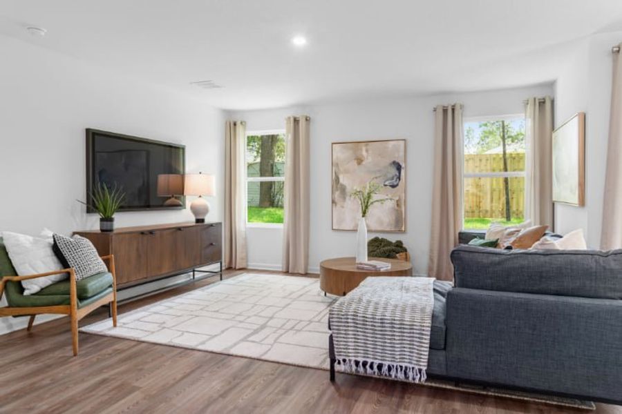 A living room with a large window.