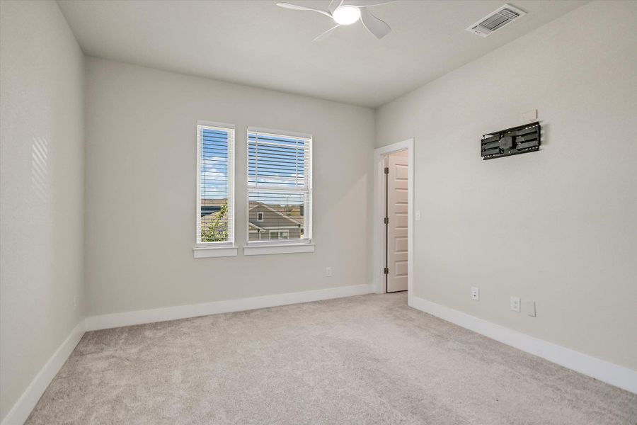 Soft carpeting pairs with neutral walls and abundant natural light in this comfortable bedroom. Soft carpeting pairs with neutral walls and abundant natural light in this comfortable bedroom.