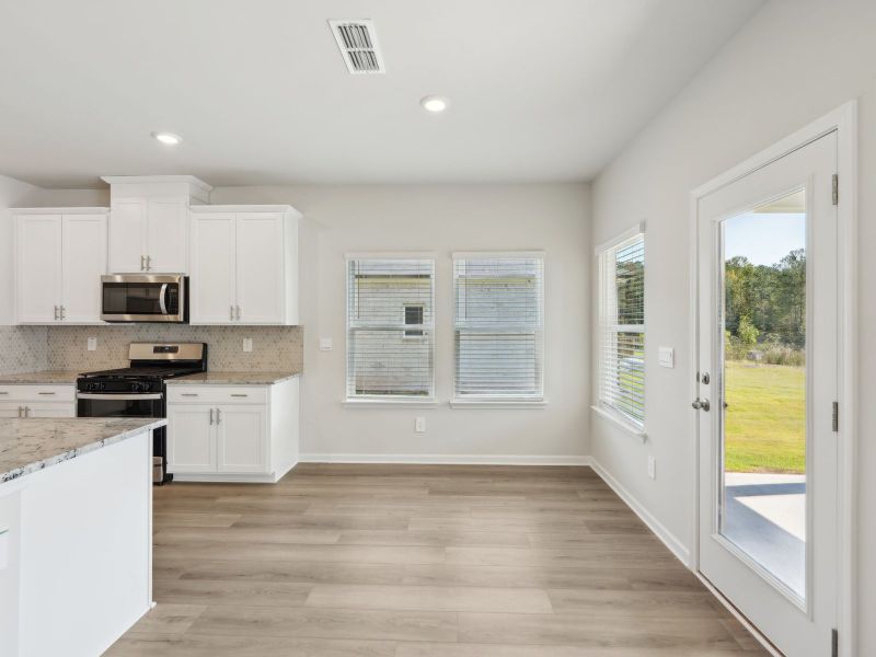 Furnished interior view inside a new home in Martin Springs - Estate Series, Lawrenceville (Image 11).