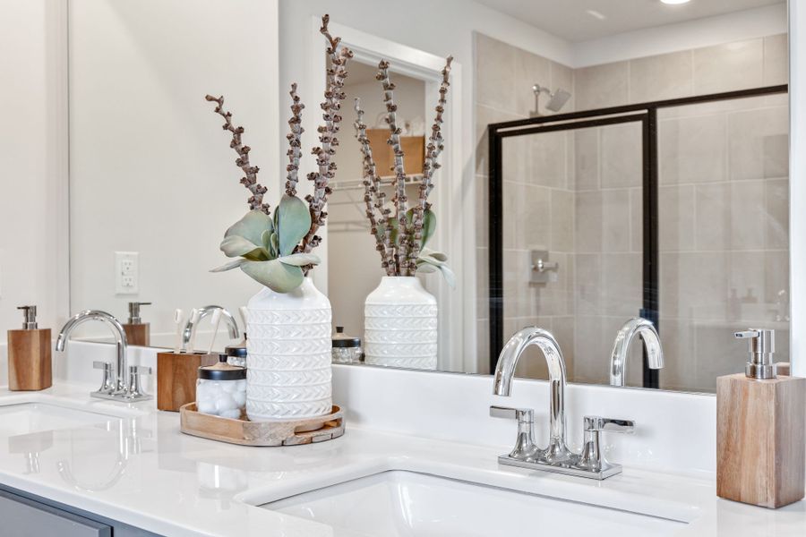 A bathroom with a large mirror. A bathroom with a large mirror.