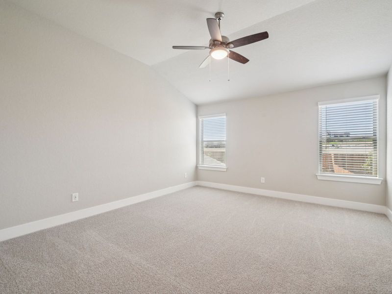 Primary suite in the Red River floorplan at a Meritage Homes community.