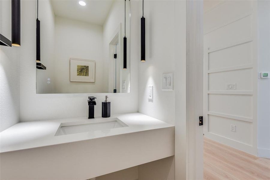 Bathroom featuring vanity, light wood-style flooring, and recessed lighting