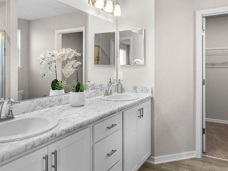 Your suite is complete with an en-suite bath with dual vanities and a tiled shower - Wesley II by Highland Homes Your suite is complete with an en-suite bath with dual vanities and a tiled shower - Wesley II by Highland Homes