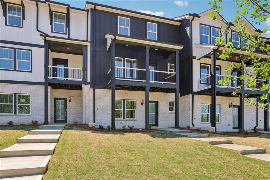 Front exterior of a new home in Hemingway - Highland Series, Cumming, GA, highlighting curb appeal (Image 2). Front exterior of a new home in Hemingway - Highland Series, Cumming, GA, highlighting curb appeal (Image 2).