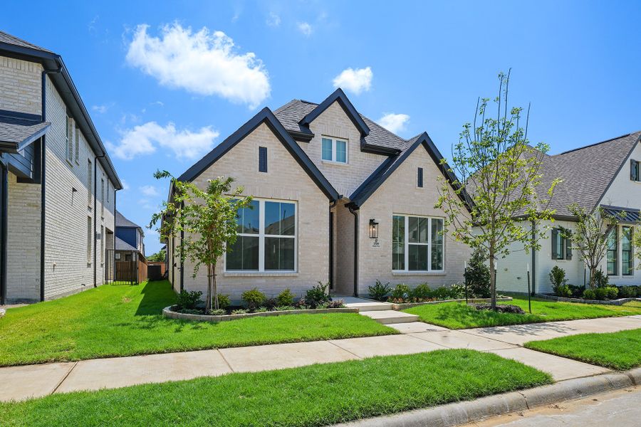 Front exterior of a new home in Cottages of Celina, Celina, TX, highlighting curb appeal (Image 22). Front exterior of a new home in Cottages of Celina, Celina, TX, highlighting curb appeal (Image 22).
