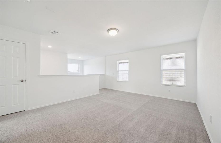 Inviting loft with large windows Inviting loft with large windows