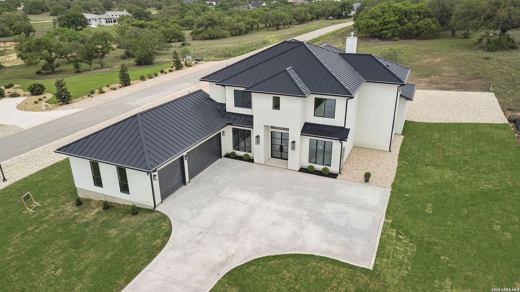 Front exterior of a new home in , Bulverde, TX, highlighting curb appeal (Image 28).