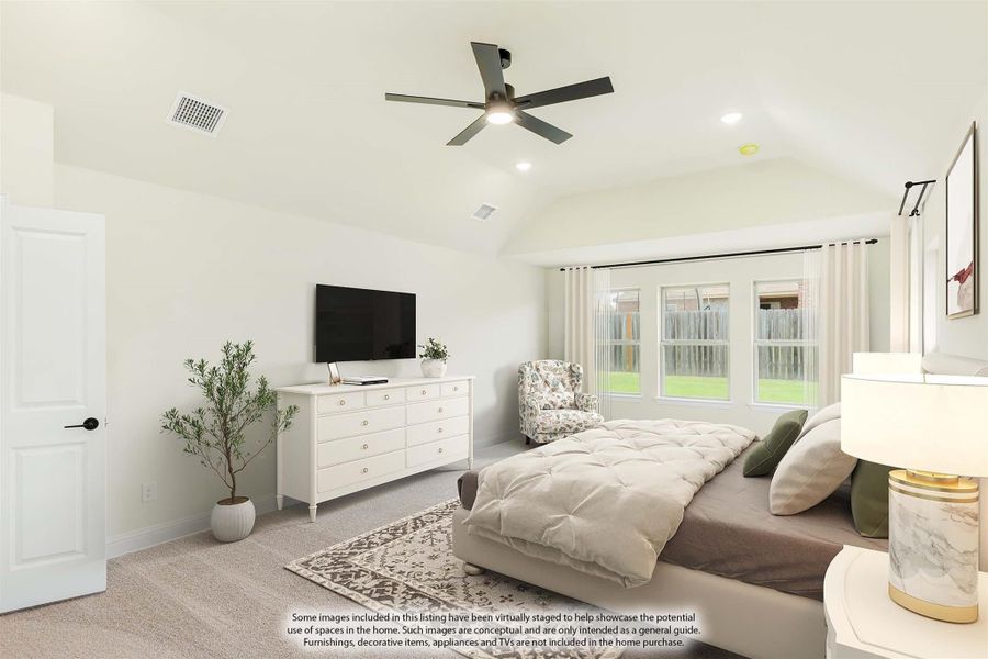 Spacious bedroom with vaulted ceiling, ceiling fan, carpet flooring, and large windows with natural light Spacious bedroom with vaulted ceiling, ceiling fan, carpet flooring, and large windows with natural light