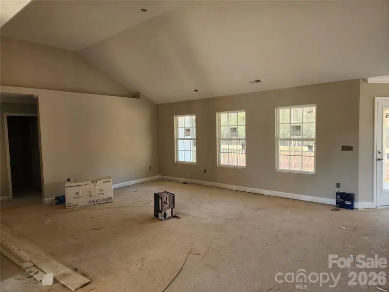 Open Vaulted Living Room w/ Plant Shelf Above