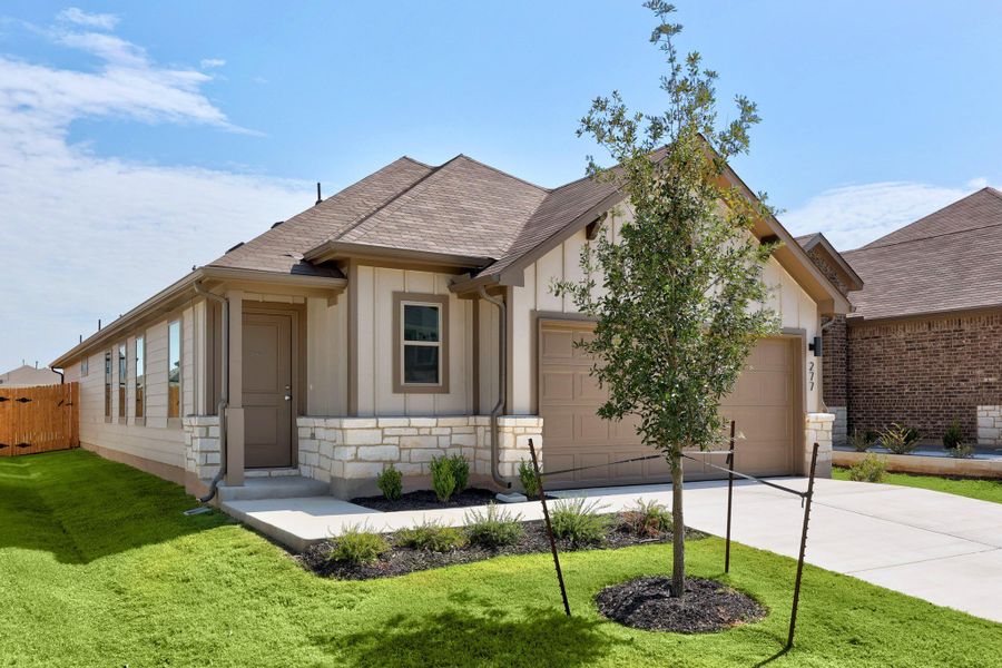 Front exterior of a new home in Trinity Ranch, Elgin, TX, highlighting curb appeal (Image 18).