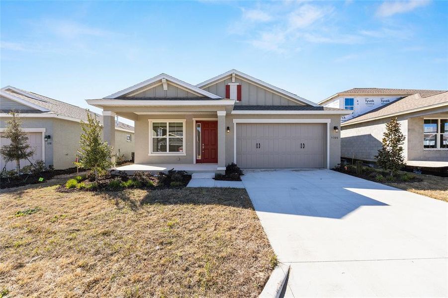 Front exterior of a new home in Calesa Township, Ocala, FL, highlighting curb appeal (Image 21). Front exterior of a new home in Calesa Township, Ocala, FL, highlighting curb appeal (Image 21).