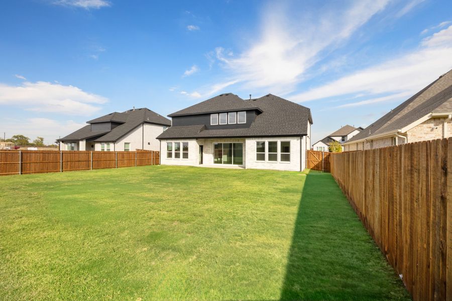 Exterior details and patio area of a home in Lake Breeze, Lavon (Image 25).