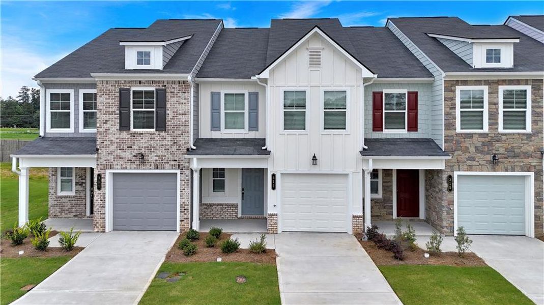 Front exterior of a new home in Village Green, Adairsville, GA, highlighting curb appeal (Image 23).