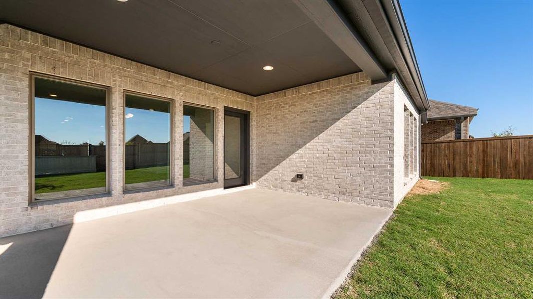 Exterior details and patio area of a home in Devonshire - Reserve 45', Forney (Image 3). Exterior details and patio area of a home in Devonshire - Reserve 45', Forney (Image 3).