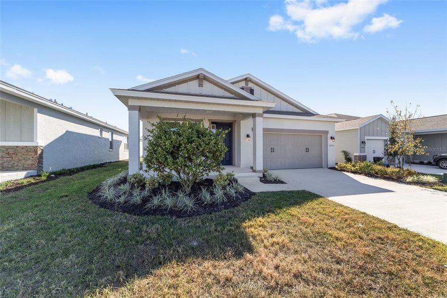 Front exterior of a new home in Calesa Township, Ocala, FL, highlighting curb appeal (Image 17).