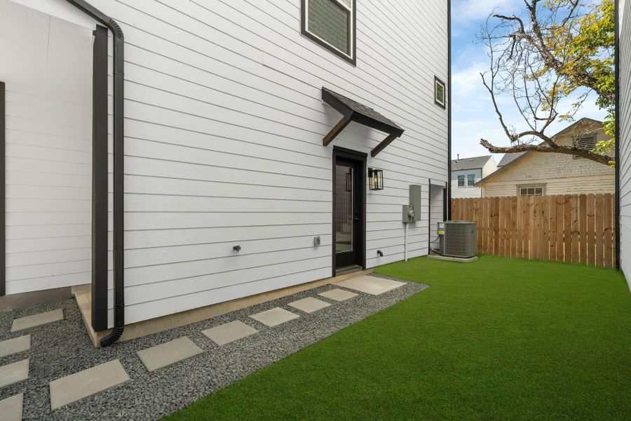 Exterior details and patio area of a home in , Houston (Image 2). Exterior details and patio area of a home in , Houston (Image 2).
