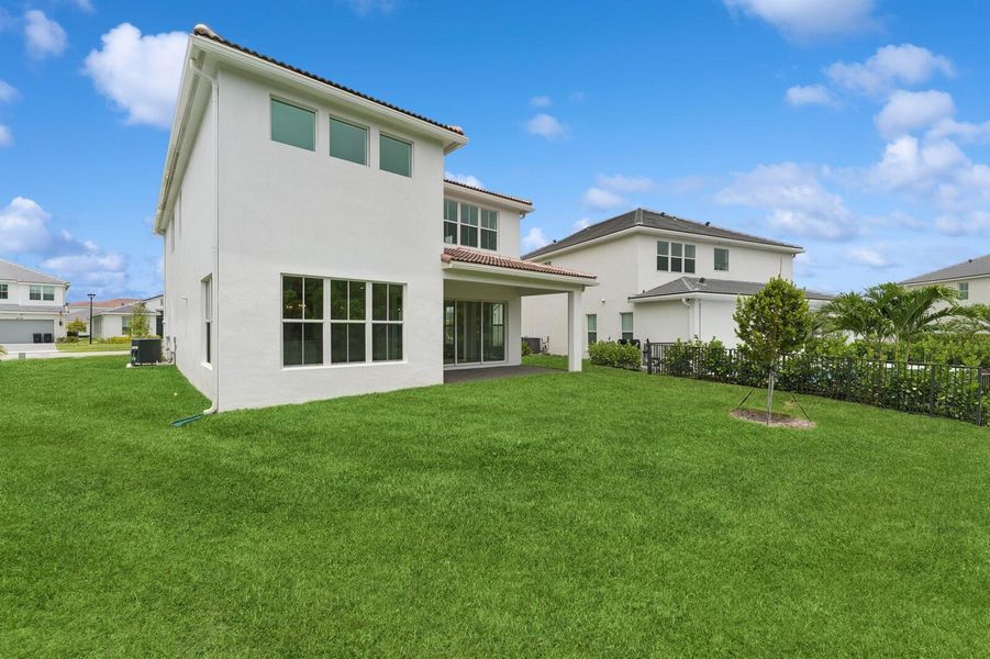 Front exterior of a new home in Salerno Reserve - Single Family, Stuart, FL, highlighting curb appeal (Image 27). Front exterior of a new home in Salerno Reserve - Single Family, Stuart, FL, highlighting curb appeal (Image 27).