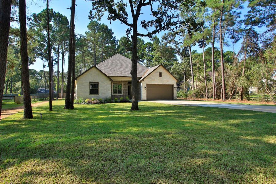 Front exterior of a new home in , Magnolia, TX, highlighting curb appeal (Image 18). Front exterior of a new home in , Magnolia, TX, highlighting curb appeal (Image 18).