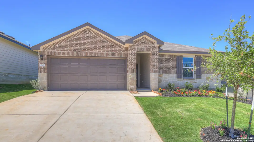 Front exterior of a new home in Arroyo Ranch, Seguin, TX, highlighting curb appeal (Image 2). Front exterior of a new home in Arroyo Ranch, Seguin, TX, highlighting curb appeal (Image 2).