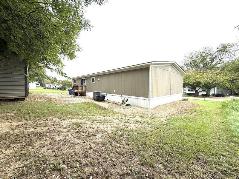 Front exterior of a new home in , Gun Barrel City, TX, highlighting curb appeal (Image 1).