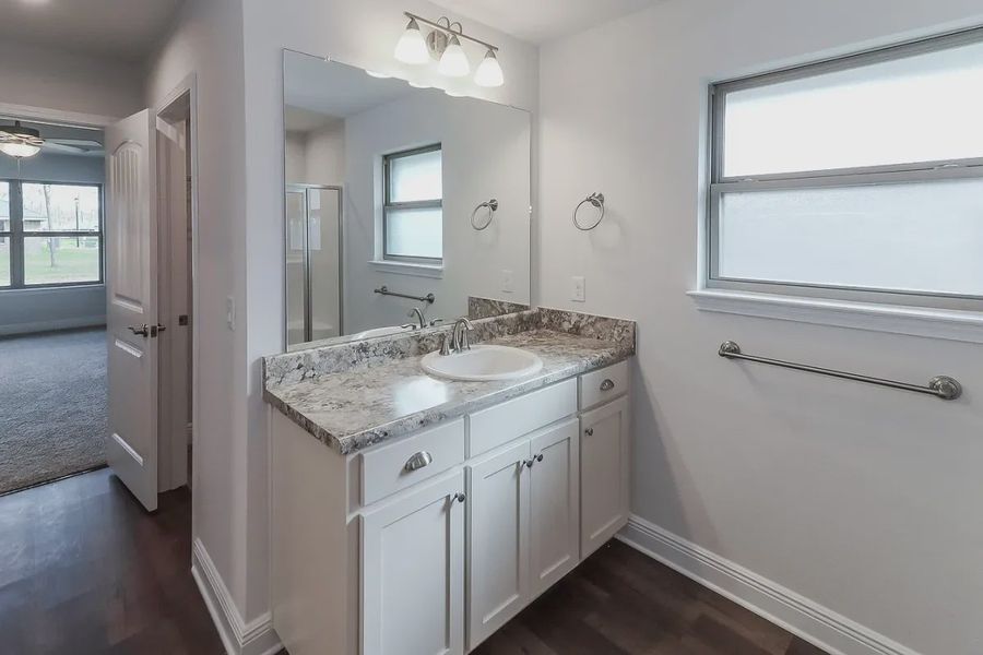 Representative furnished interior of a home built from the Plan 2502 by Adams Homes in Cedar Creek at Deerpoint Lake, Panama City (Image 11).