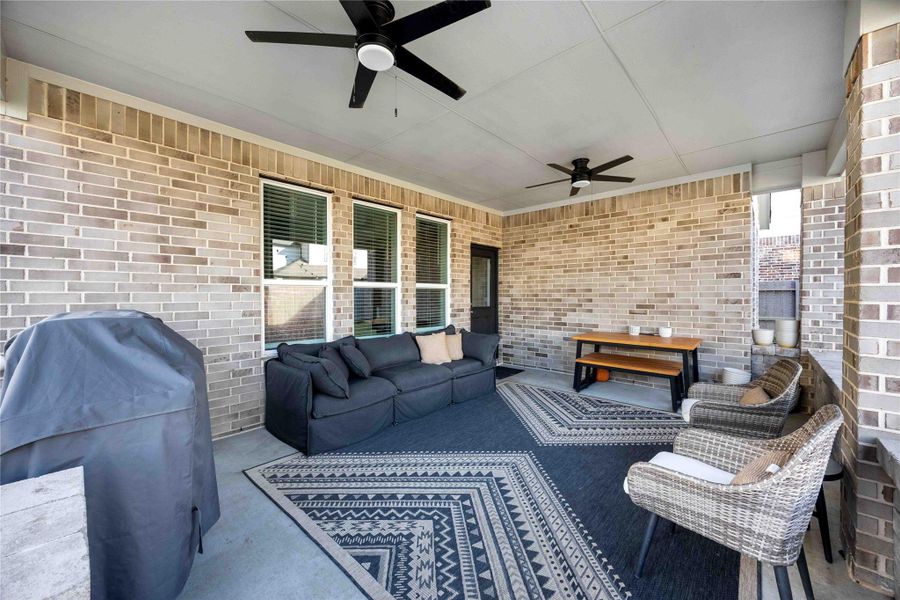 Spacious covered back patio perfect for outdoor dining, relaxing, or entertaining. Spacious covered back patio perfect for outdoor dining, relaxing, or entertaining.