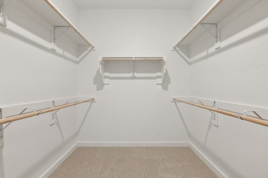 Primary Closet in the Masters home plan by Trophy Signature Homes – REPRESENTATIVE PHOTO