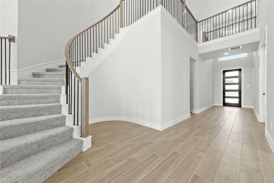 Spacious, unfurnished interior of a new home in Sunterra, Katy (Image 19).