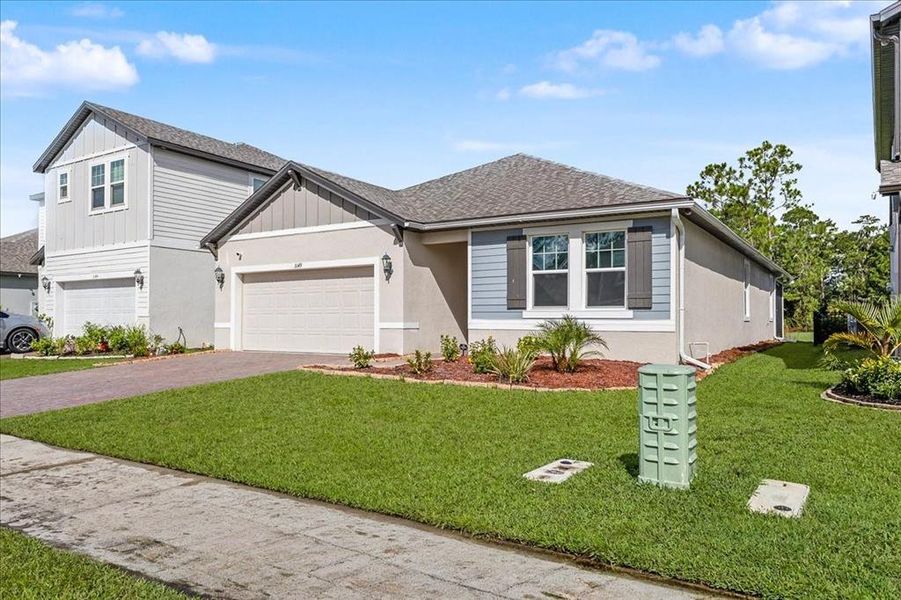 Front exterior of a new home in , Daytona Beach, FL, highlighting curb appeal (Image 23). Front exterior of a new home in , Daytona Beach, FL, highlighting curb appeal (Image 23).
