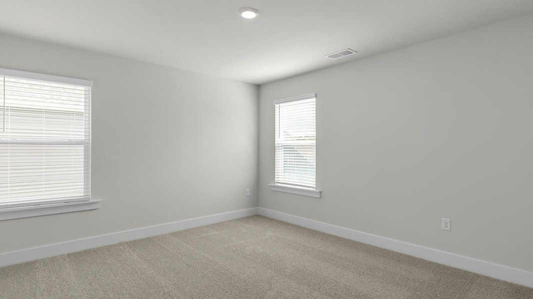 Spacious, unfurnished interior of a new home in Surfside Landing, Hubert (Image 38).