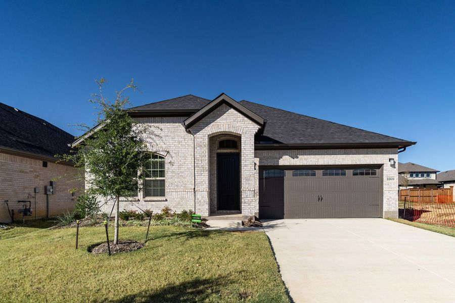 Front exterior of a new home in La Terra, Celina, TX, highlighting curb appeal (Image 1).