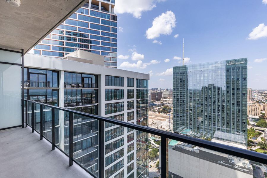 City views from a private balcony, offering an urban oasis high above the streets.