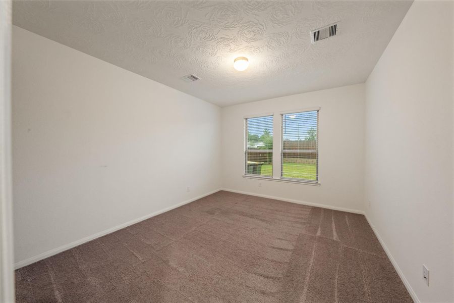 Spacious, unfurnished interior of a new home in Grace Landing, Willis (Image 17).