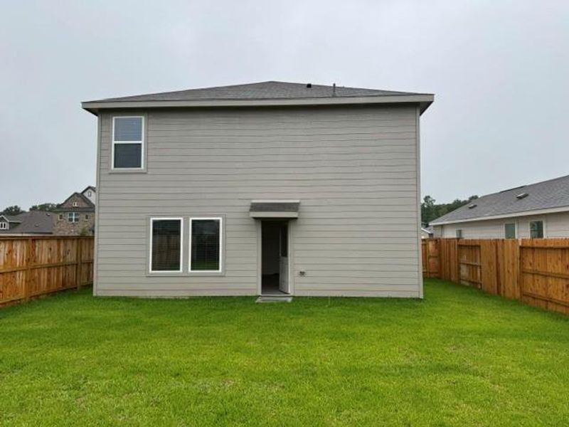 Exterior details and patio area of a home in , New Caney (Image 3).
