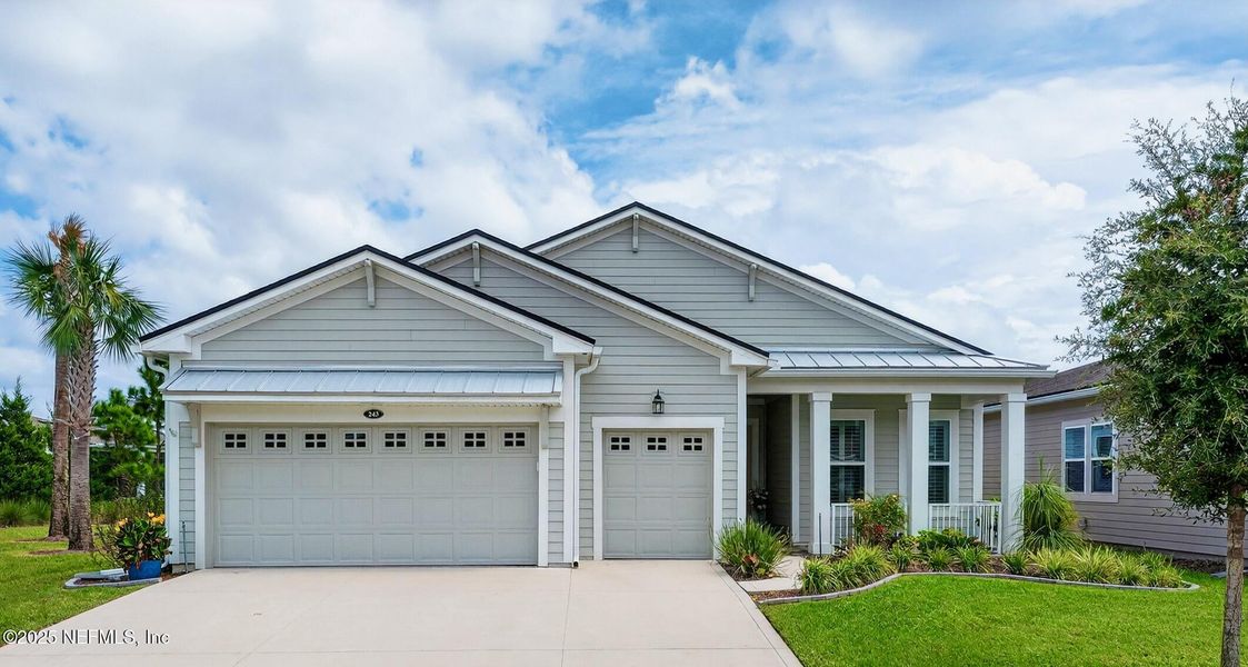 Front exterior of a new home in , St. Johns, FL, highlighting curb appeal (Image 20). Front exterior of a new home in , St. Johns, FL, highlighting curb appeal (Image 20).