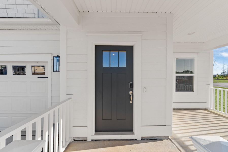 Exterior details and patio area of a home in The Coves at Lakes of Cane Bay, Summerville (Image 32). Exterior details and patio area of a home in The Coves at Lakes of Cane Bay, Summerville (Image 32).
