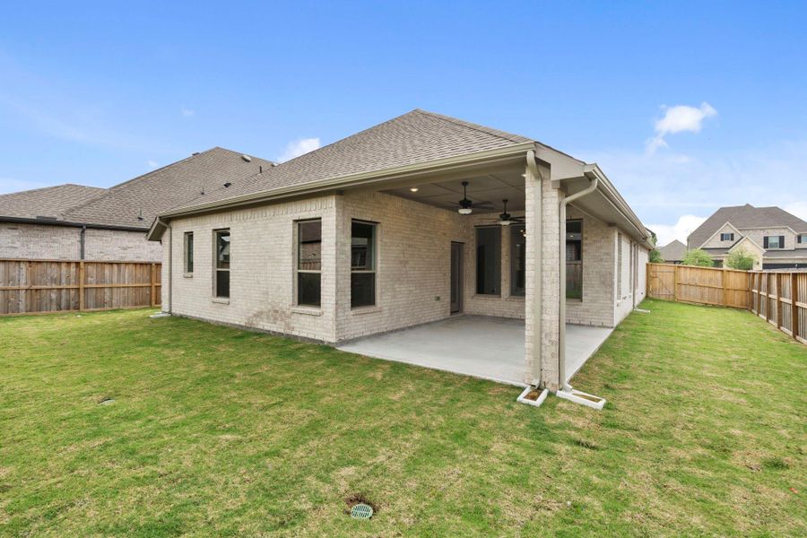 Exterior details and patio area of a home in Dunham Pointe, Cypress (Image 23).