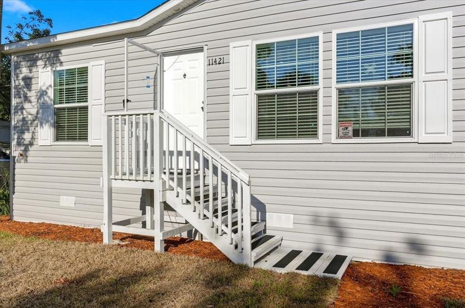 Exterior details and patio area of a home in , Port Richey (Image 19).