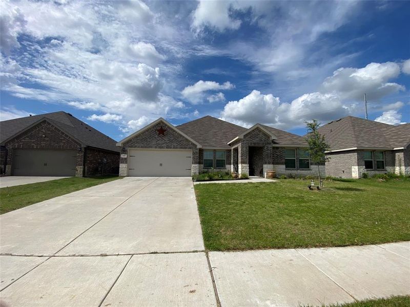 Front exterior of a new home in Stonehaven, Caddo Mills, TX, highlighting curb appeal (Image 2). Front exterior of a new home in Stonehaven, Caddo Mills, TX, highlighting curb appeal (Image 2).