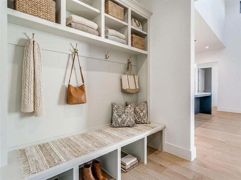 Vitrual staged Mudroom featuring light wood-style flooring and baseboards Vitrual staged Mudroom featuring light wood-style flooring and baseboards