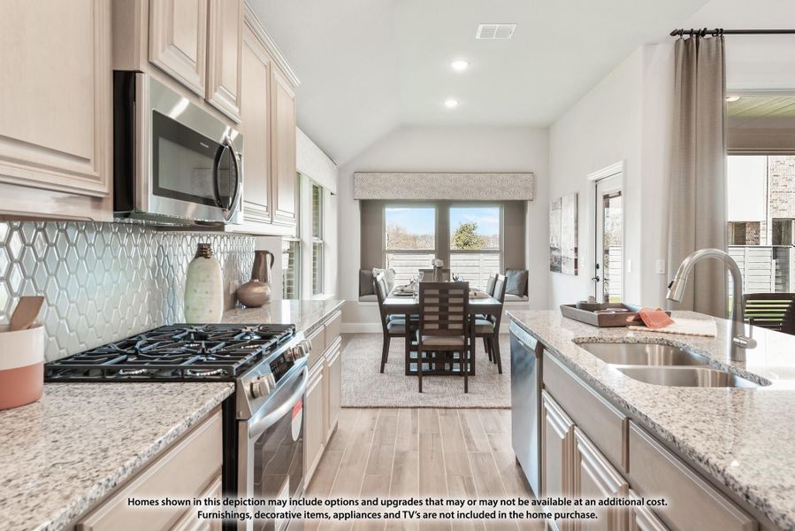 Kitchen with granite countertops, stainless steel appliances, tile backsplash, and dining area in background