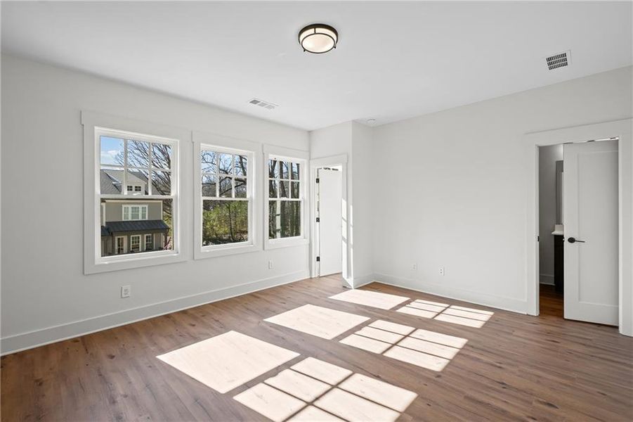 Spacious, unfurnished interior of a new home in Devin's Shire - A Kennesaw Tradition, Kennesaw (Image 32).