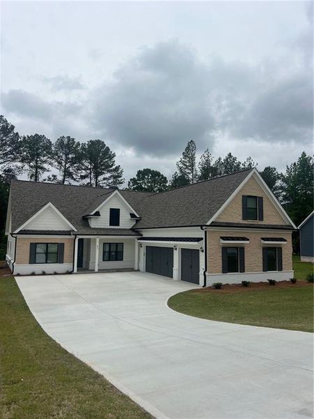 Front exterior of a new home in , Loganville, GA, highlighting curb appeal (Image 2). Front exterior of a new home in , Loganville, GA, highlighting curb appeal (Image 2).
