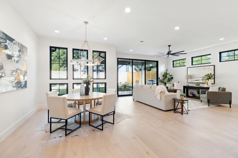 Dining space with recessed lighting, light wood-style flooring, plenty of natural light, and a ceiling fan