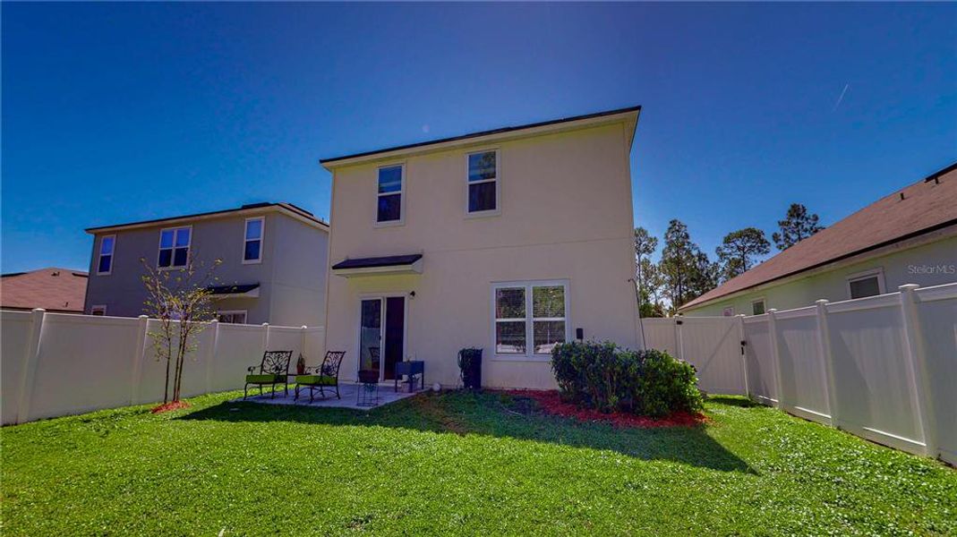 Exterior details and patio area of a home in Sawmill Branch Express, Palm Coast (Image 27).