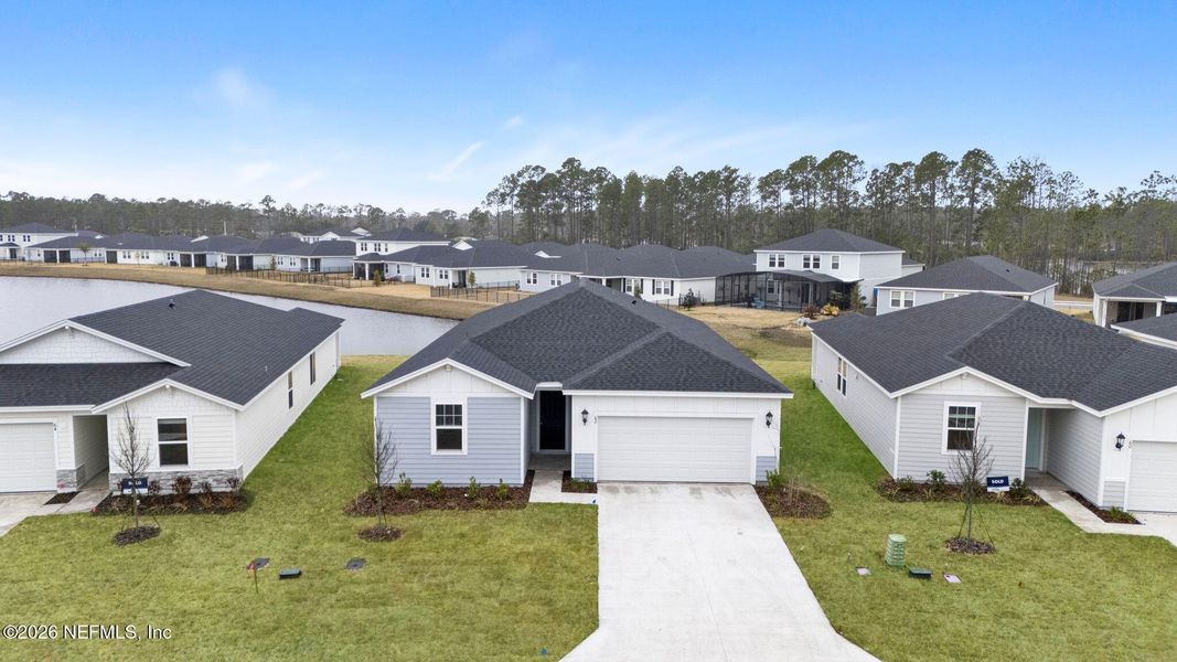 Front exterior of a new home in , Palm Coast, FL, highlighting curb appeal (Image 2). Front exterior of a new home in , Palm Coast, FL, highlighting curb appeal (Image 2).